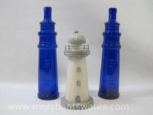 Two Blue Glass Lighthouse Bottles, with a Woodlook Lighthouse Figure