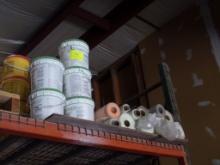 Pallet w/Rolls Of Plastic And Assorted Chemiclas On Top Shelf Of Pallet Rac