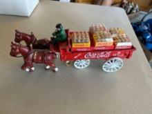 Vintage cast iron Coca Cola horse drawn wagon with pop cases included.... Nice!!