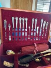 Silverware in silverware case.