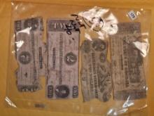 Four old pieces of Confederate currency