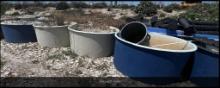 Approx. 9 extremely large Red Ewald Inc. fiberglass tubs with oyster shells inside