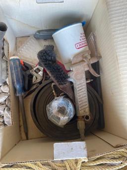 box of rope, tools, oil spout