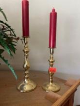 Gold candleholders with cranberry colored candles