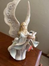 Angel letting a Dove go figurine