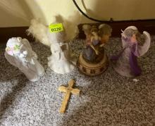 angel figurines, and wooden cross