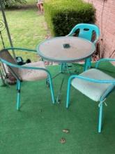 patio table and three chairs two chairs match one does not