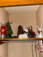 Christmas tree Candle holder with red candle pair of deers., and decorative pine cones.