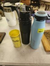 2 insulated water bottles and measuring cup