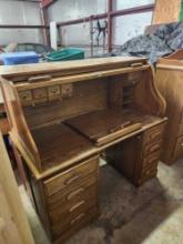 large wooden office desk with roll down top