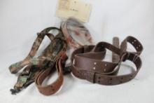 One padded nylon rifle sling and three leather rifle slings.