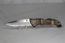 Buck 285 lockback knife, camo with belt clip and ambidextrous thumb stud