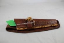 One brown leather right handed belt holster. Used.