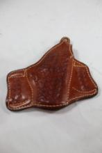 One brown leather Buckeimer right handed snap belt holster, 004LW62. Used.