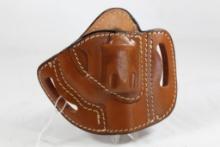 One TX 1836 Lt brown right handed belt holster for 2" revolver. Used in good condition.