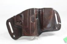 One TX 1836 dark brown right handed belt holster with magazine carrier for automatic pistol. Used,