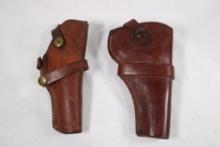 One BL& A chicago holster 418 and other leather revolver holster, center strap is broken