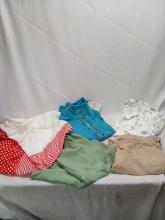 2XL Cloting Lot. 2 T-Shirts, 1 Pair Of Pants, 1 Short Romper, And 1 Dress.