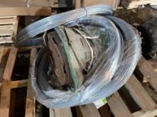 USED PART OF TRANSMISSION AND 3 ROLLS OF GALVANIZED WIRE