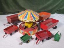 Vintage Tin LItho Lever Wind Up Carousel Toy and 7 Farm Wagons and Wheel Barrows Featuring Ertl
