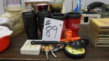kitchen lot, various travel cups, oil spouts and coasters