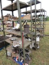 Shelving units in row and pipe on ground