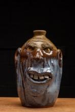 Blue and Brown Face Jug with Square Teeth by Billy Joe Craven