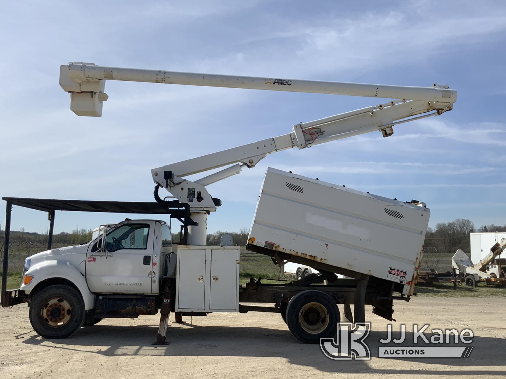 (Charlotte, MI) Altec LRV55, Over-Center Bucket Truck mounted behind cab on 2010 Ford F750 Chipper D