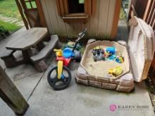 Children's sandbox, picnic bench and toys
