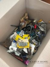 box of assorted tools and hardware