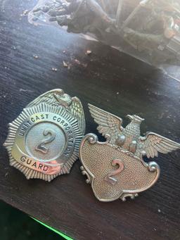 metal officer badges. (upstairs)