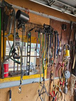 assorted tools and miscellaneous on wall