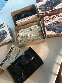 3- model car kits 1- partial put together /2- complete