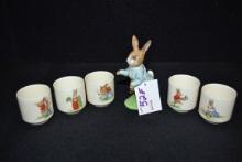 Peter Rabbit Porcelain Figurine, Beswick, England, and Set of 5 Royal Doulton Bunnykin Egg Cups