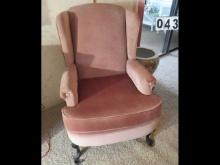 Mauve upholstered wing back chair