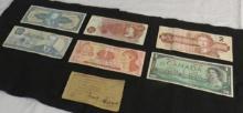 Lot of foreign money, Canada 1 dollar, Canada 2 dollar, England 10 shillings, Brasil 2, Costa Rica 1