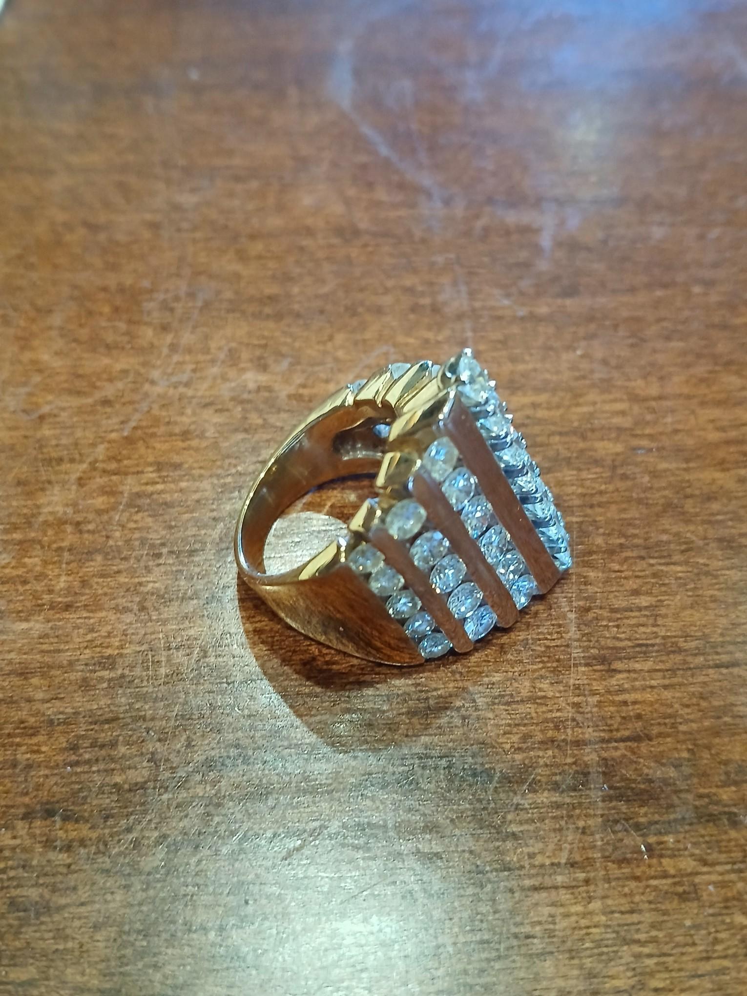 14K Gold Diamond Ladies Ring / 22.3 Grams of 14K gold. The ring is a 7 channel ring, very heavy gold