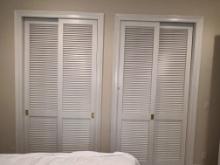 Set of Sliding Louvered Closet Doors with Track and Frame