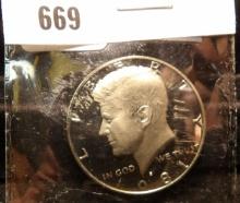 1981 S Kennedy Half Dollar, Deep Cameo Proof, stored in a flip.