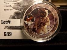 Astronaut "Standing on Moon" dollar-size coin, encapsulated.