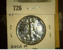 1946 P Walking Liberty Half Dollar. With the reverse highlighted in gold.