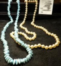 Blue Plastic Bead Necklace and an imitation Pearl Necklace.