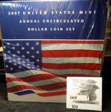 2007 U.S. Mint Annual Dollar Uncirculated Coin Set. Includes the one ounce Silver American Eagle.