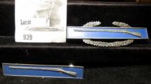 Military Pins: (2) unknown Sterling Silver Flintlock Rifle pins, both total weight 27.3 grams withou