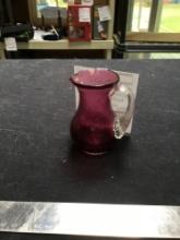 vintage cranberry glass pitcher with applied handle, marked on bottom