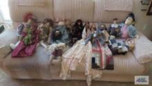 Sofa full of homemade dolls with very ornate Victorian costumes