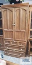 Large entertainment center. The middle piece is 3 ft long by 77 in tall by 22-1 /2 in deep. Each