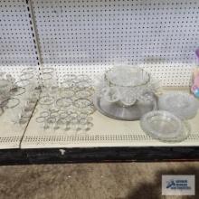 Lot of silver rimmed stemware, clear glass plates, and punch bowl set