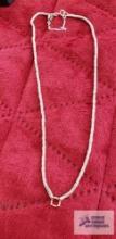 Silver colored necklace, marked Sterling 6.0 G,...missing stone (Description provided by seller)