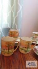 Nippon hand painted lake scene cups and saucers